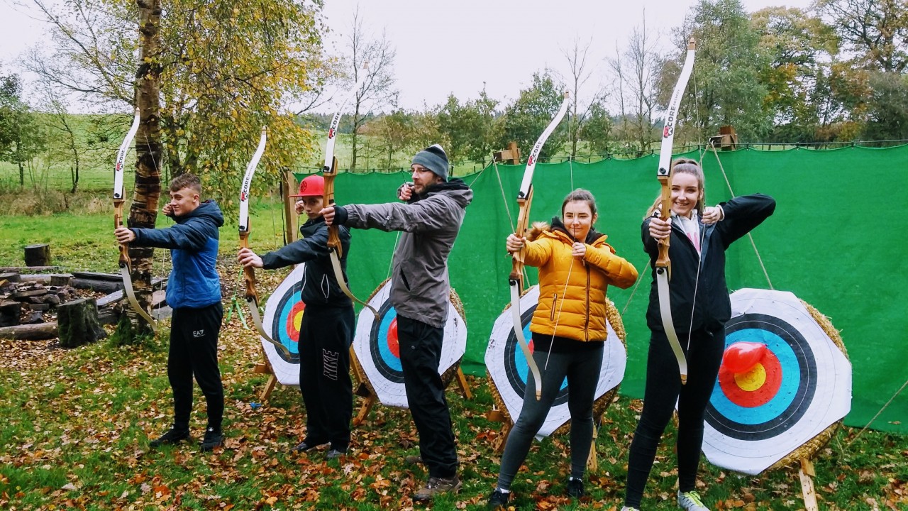 archery group photo in front of targets